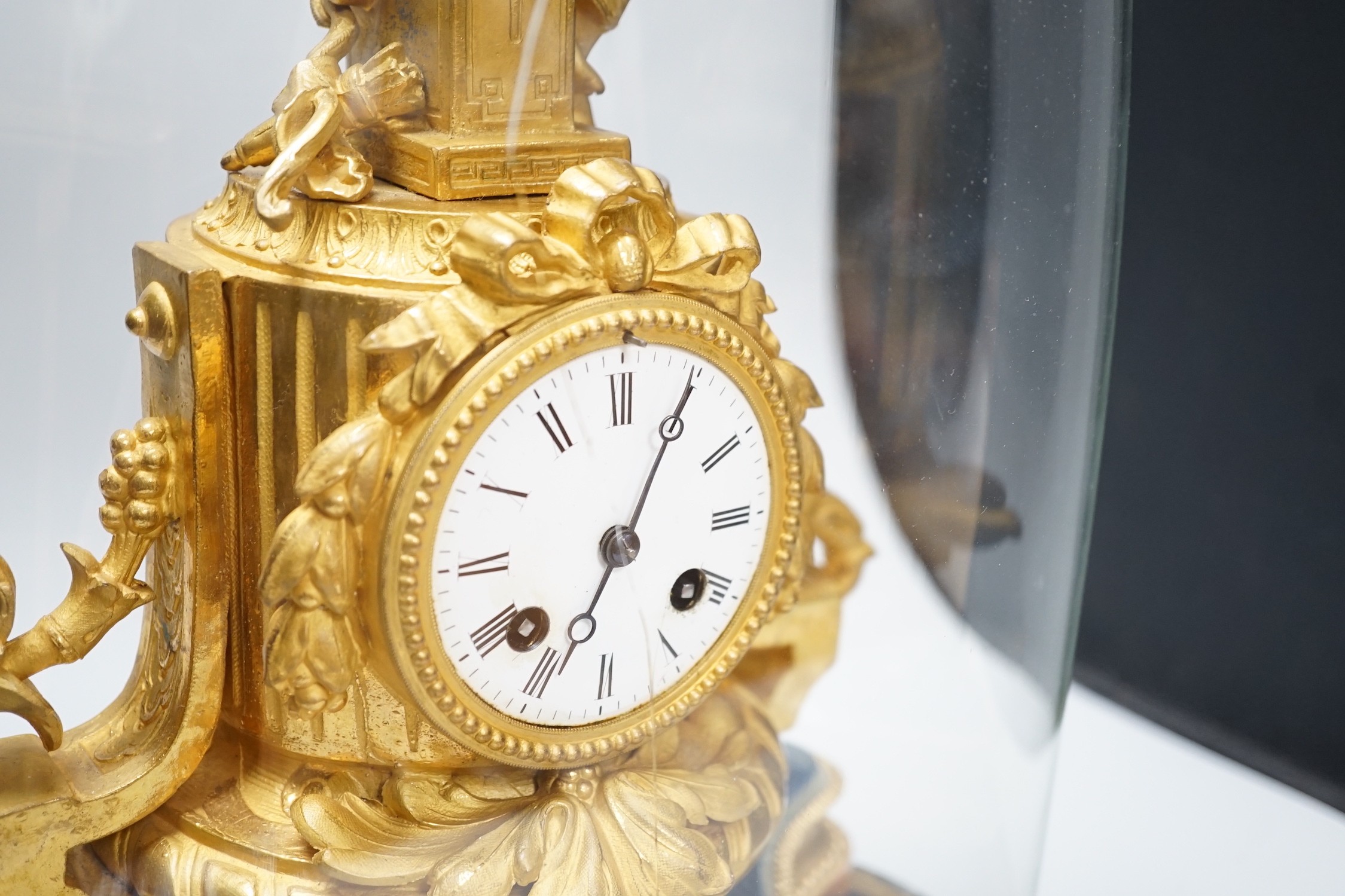 A French 19th century gilt metal clock by Phillipe H. Mourey on stand with glass dome, total height 49cm (dome a.f.)
